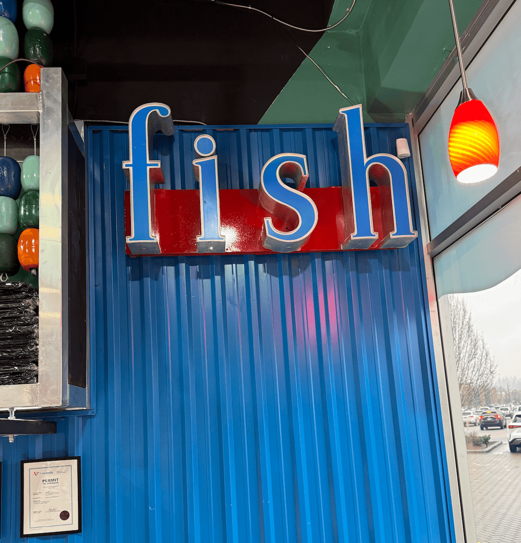 Staff preparing seafood for customers